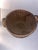 This is an antique round splint basket featuring a rich dark patina and dual integrated side handles . his is an antique...
