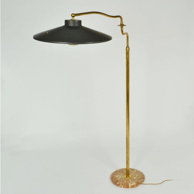 The articulated Italian swing arm brass floor lamp is multi functional added by its extending swivel arm. The original...
