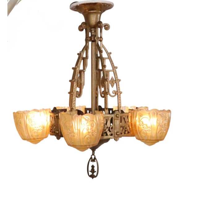Exceptional Art Deco hanging chandelier, having a decorative metal frame, with five original "slip" shades. Made by the...