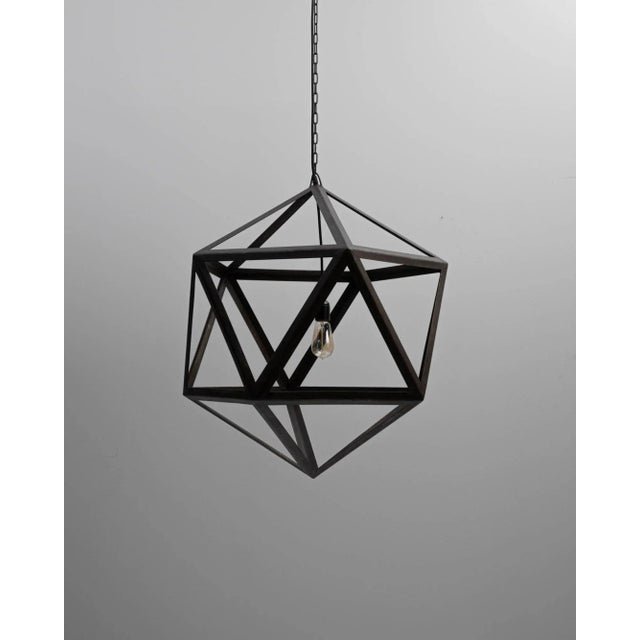 A prototype created in our atelier, this platonic pendent is created entirely from welded steel angle rods. The star-like...