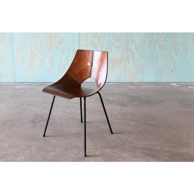 A 1950s Ray Komai chair by J.G. Furniture Company in Brooklyn, New York. The chair features a molded mahogany plywood body...