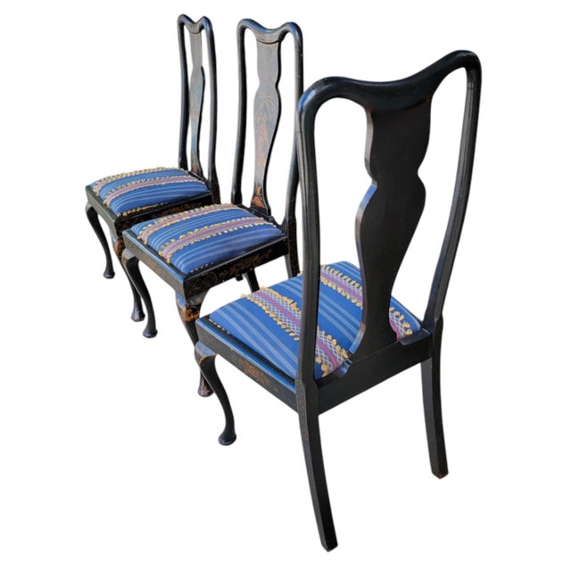 This is a set of four English regency style hand painted Japanned side chairs. The backs have Queen Anne styling with four...