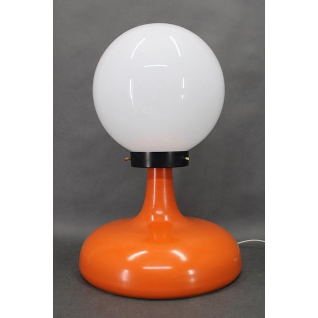 This italian space age table lamp dates from the 1970s and exemplifies the bold forms and material experimentation...