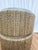 Round side table by Kravet crafted with a wood structure and wrapped in natural woven seagrass. The piece features a...