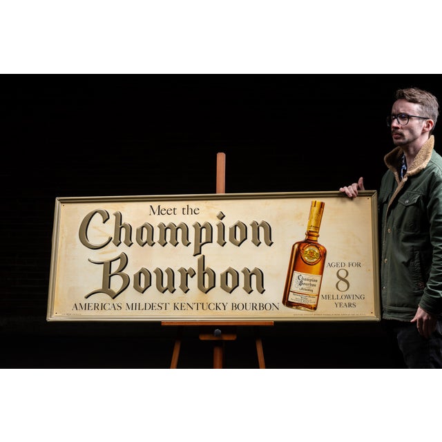 Vintage embossed and lithographed tin advertising sign produced for Champion Bourbon by Schenley Distillers Corporation of...