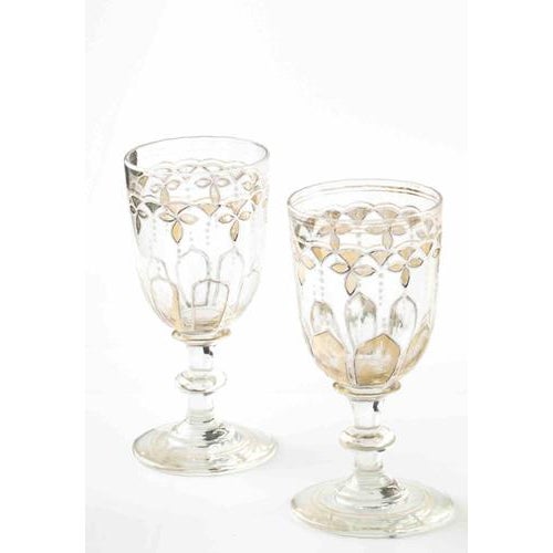 Vintage set of glass liqueur service set realized in Europe in the Early 20th Century. It includes a tall glass decanter...