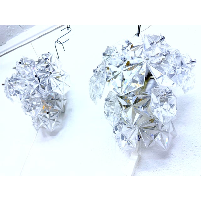 Two wall lamps from the 1970s by Kinkeldey. The two lamps have different mounting systems: one is attached via two screw...