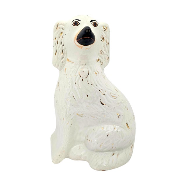 A substantial matched pair of late nineteenth-century English Staffordshire spaniel mantel dogs, dating to circa...