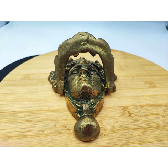 Pre-war brass knocker, woman's head, dimensions - height: 17.3 cm, width at the widest: 13.2 cm - measured without the...