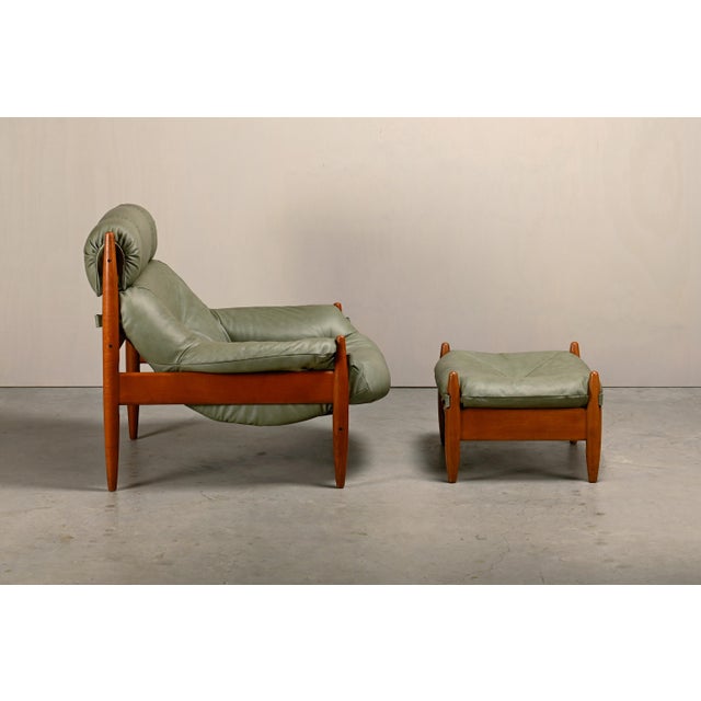 Ultimately comfortable lounge chair with footstool. Solid oak frame with newly upholstered soft Sage Green leather...
