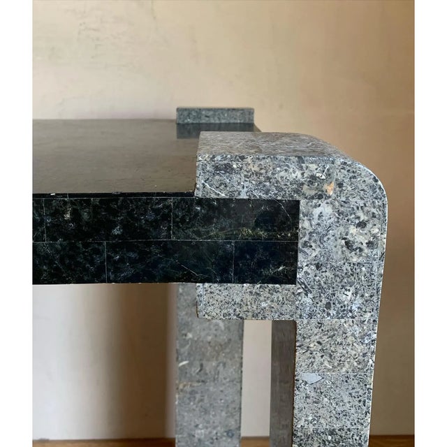 Wild and edgy vintage tessellated marble console or entry table. Reverse-direction legs and curving "feet" give it an...