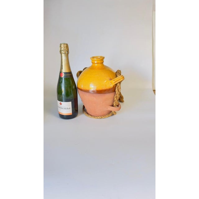 Medium-Sized Provençal-Style Pottery Jar, Yellow Ochre Glaze, 20th Century This charming medium-sized pottery jar, crafted...