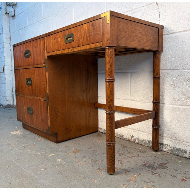 A classic Mid-Century Campaigner desk by Dixie Furniture, known for its clean lines, thoughtful proportions, and quality...