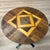 Heavy wrought iron table with uniques wood pattern designed by Tim McClellan