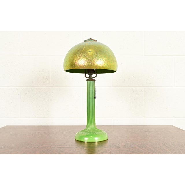 A gorgeous Arts & Crafts or Art Nouveau period Favrile iridescent art glass table lamp or desk lamp By Louis Comfort...