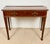 Elegant Spanish console table crafted in wood during the late 20th century. The piece features a long rectangular top...