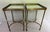 Elegant pair of Global Views accent or side tables featuring an antique brass finish with inset glass tops. Each table is...