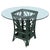 A forest green Bielecky style rattan dining set comprising a round glass top dining table and five barrel back armchairs....