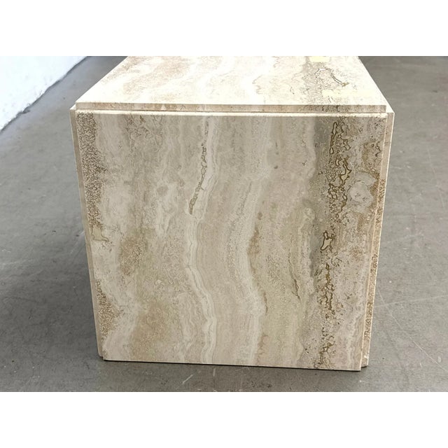 Sculptural vintage travertine cube side table featuring beautiful natural veining in warm ivory, beige, and cream tones....
