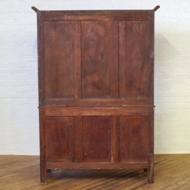 This cupboard is most likely of Welsh origins and features 2 doors above and 3,2,1 arrangement of drawers, all with...