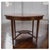 An Exquisite Hepplewhite-Style Beveled Oval Occasional table, raised on four tapering rectangular legs stuns with its...