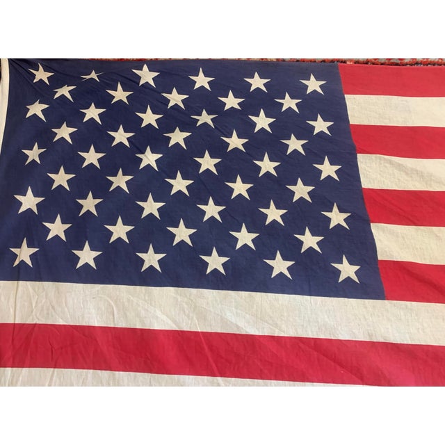 Vintage 50-star American flag in good vintage condition with strong colors and a great display look. Shows some age and...