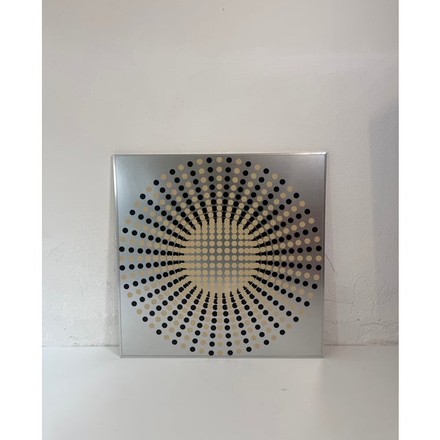 This work represents a kinetic painting created in Italy in the 1970s. It features a polka dot decoration applied to a...