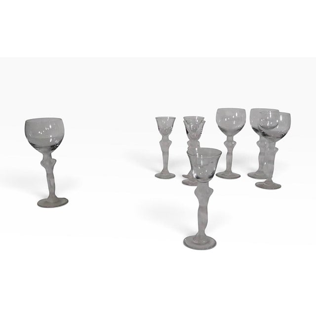 Chic set of eight Venus Bacchante wine and cordial stemware glasses, by Bayel, made in France circa 1970's. Executed in an...