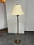Design Plus Gallery presents a Vintage Floor Lamp. This vintage floor lamp has a brass-tone metal frame with clear cut...