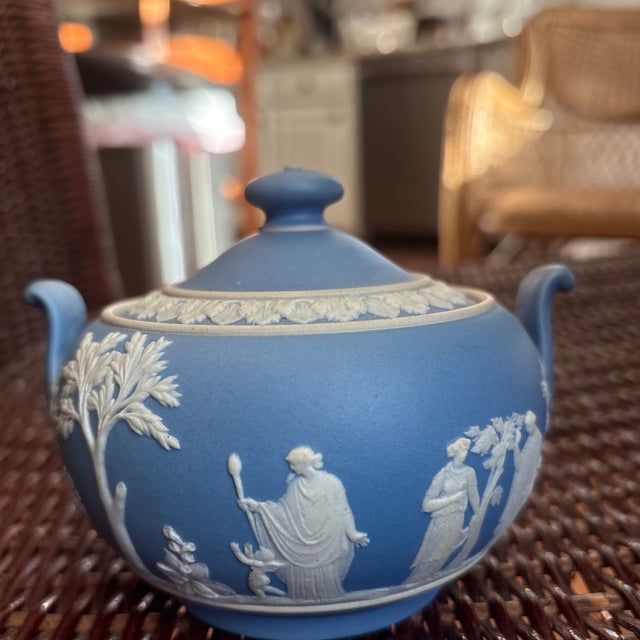 Antique Wedgwood sugar bowl circa 1890's. It is cornflower blue with women in neoclassical garments, Cupids, flowers, and...