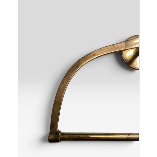 A post modern brass ice pick inspired towel hanger. Applied patina from beautiful aging.