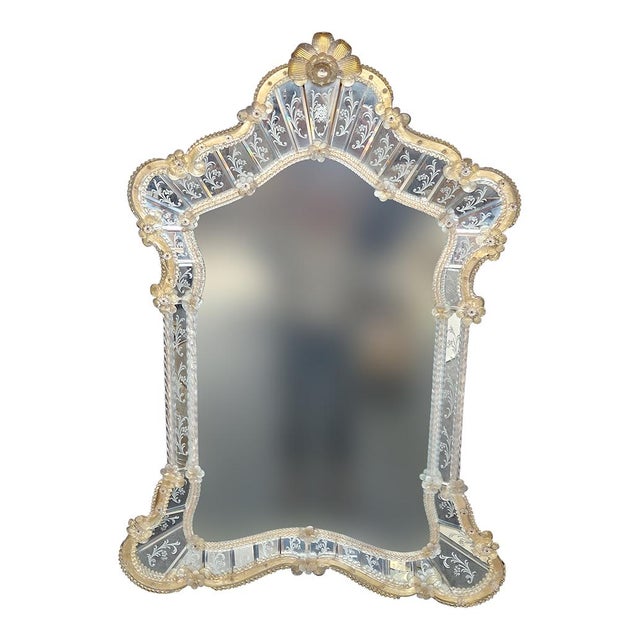 Murano glass mirror Elegant Venetian mirror made in the most rigorous Murano tradition with rich bands carefully engraved...
