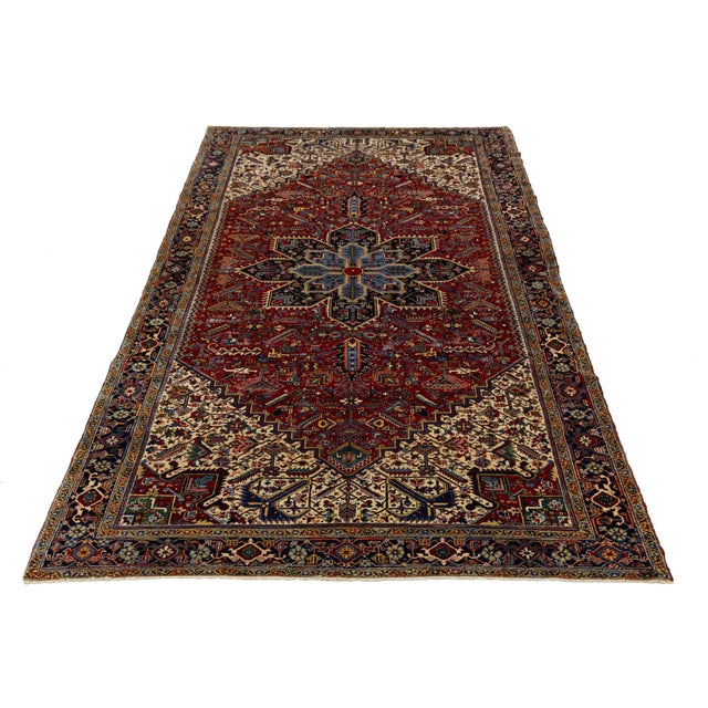 This stunning 10x18 antique Persian Heriz rug exemplifies Northwest Persian craftsmanship, featuring iconic architectural...