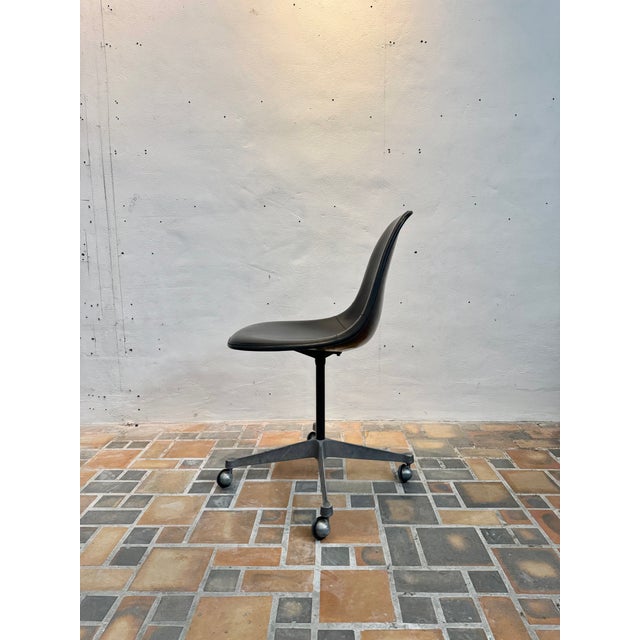 These leather Eames Shell Chairs with casters are a perfect blend of iconic mid-century modern design and functionality....
