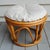This vintage bamboo/rattan ottoman has a new cushion made of tweed in the style of the mid century original cushion. The...