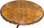 Napoleon III style tilt-top entry table showcasing exceptional craftsmanship. The table features a three-leg base carved...