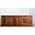 An immense 19th century French Louis Philippe walnut enfilade, the staggering scale feels even more expansive by the red...
