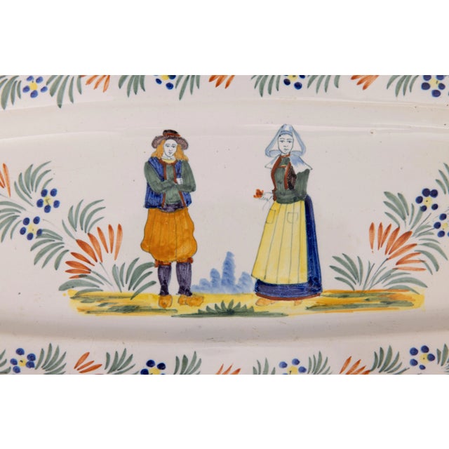 A superb large antique French provincial faience Quimper oval wall platter or charger, circa 1920. Marked "Henriot Quimper...