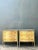 A pair of vintage hand-painted wood chests, likely dating from the mid-20th century, showcase a charming patina that...