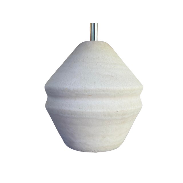 A vintage ceramic table lamp (circa 1970s) with a sculptural gourd-form base in a textured, matte ivory glaze — a faceted,...