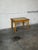 This charming coffee table features an inset tile top adorned with a detailed leaf print, complemented by classic turned...