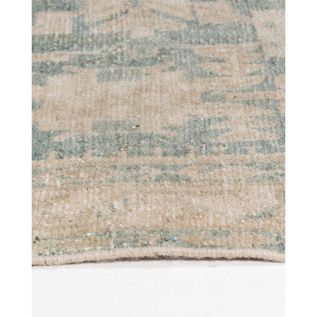 A beautiful hand-knotted rug, traditionally crafted by skilled artisans using fine-quality wool. The hand-knotted...