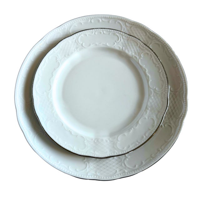 An exquisite Seltmann Weiden porcelain dinner set, embodying the quiet sophistication of European fine dining. Its...