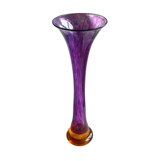 Signed art glass vase by Young & Constantin, numbered 0299236. The tall trumpet form features a vibrant amethyst body with...