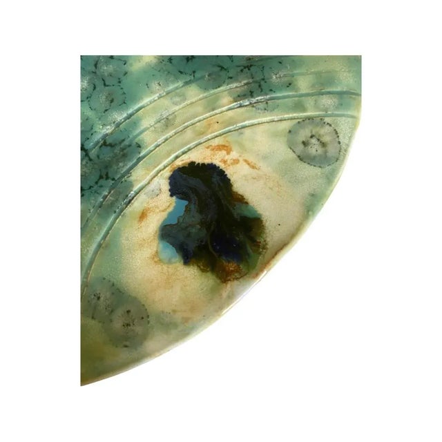 Vintage Mid Century Modern Studio Pottery Catchall in Sea Green Tones on Three Legs. The glaze was applied in such a way...