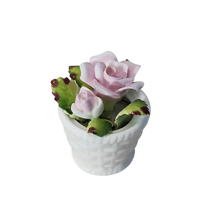 Pretty trio of collectible fine china floral basket figurines, two from Thorley China Co. Ltd of England, and one from...