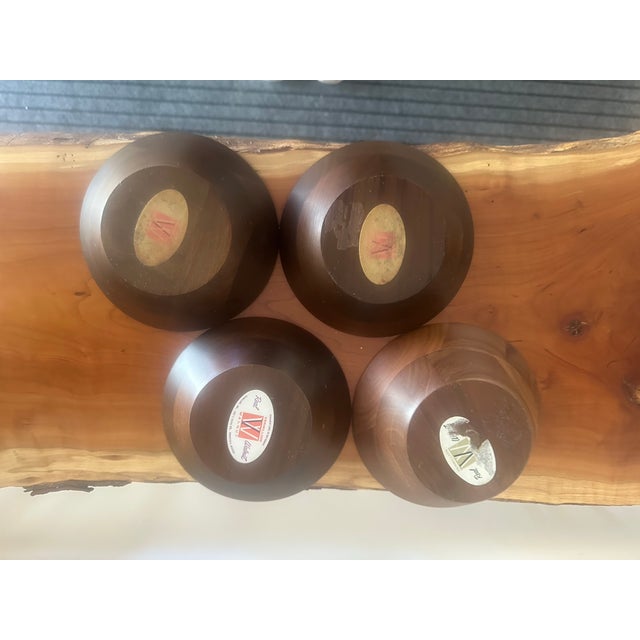 Marked to vermilion walnut. A set of four beautifully turned wooden bowls with a smooth, warm finish. These versatile...