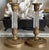 Elegant pair of antique French Empire Revival candlesticks crafted in gilt brass with faceted cut glass columns. These...