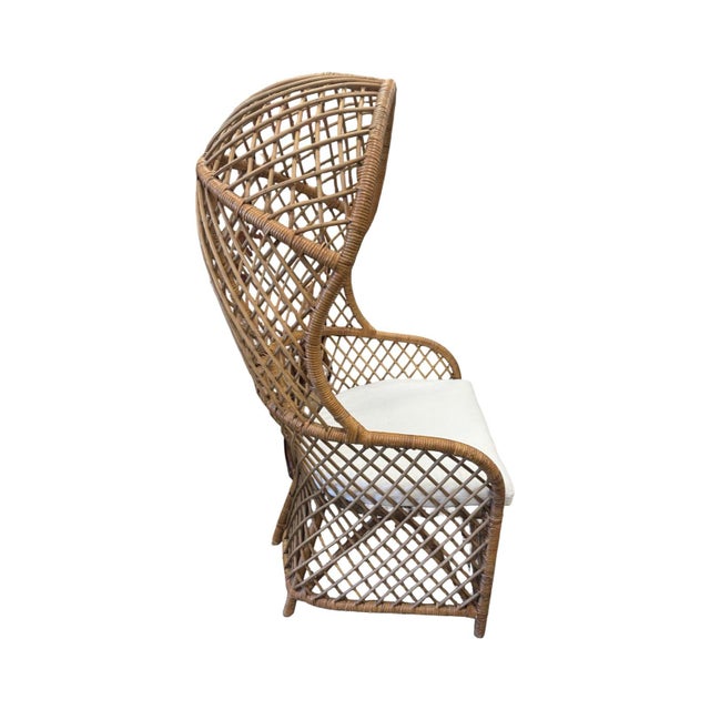 This Fabulous Throne Chair! Made of wicker and what a rare one she is! The cushion is white linen. Bring some Palm Beach...