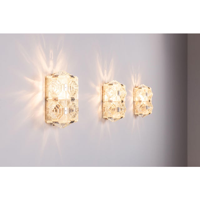 A striking set of six vintage wall lamps from the renowned glassmaking town of kamenický šenov. These elegant fixtures...